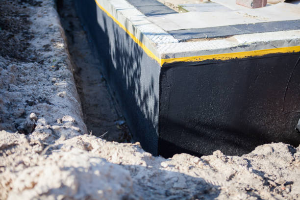 Professional Basement Waterproofing technician working in Kent City, MI